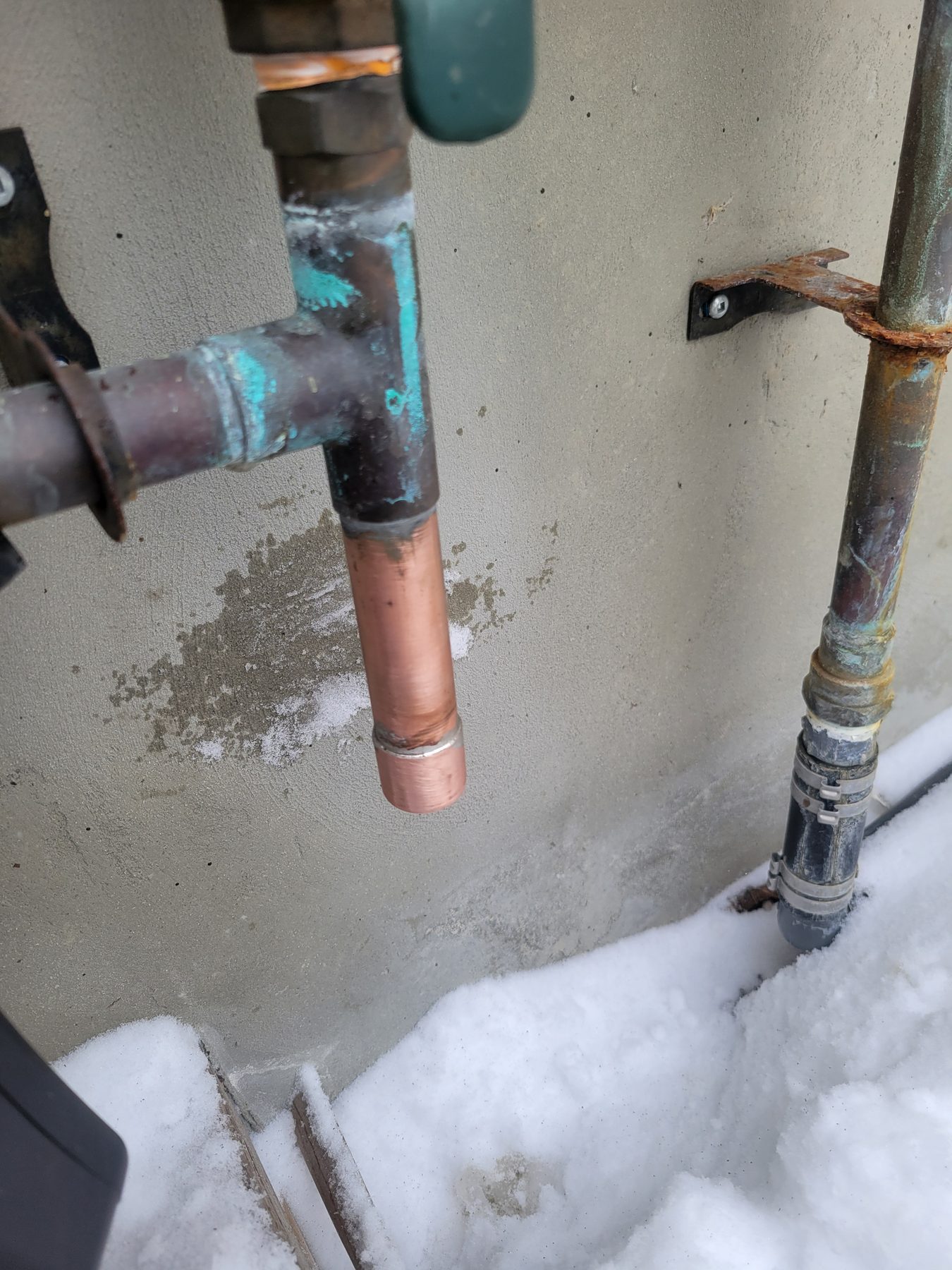 Exterior copper water service line repair in the snow